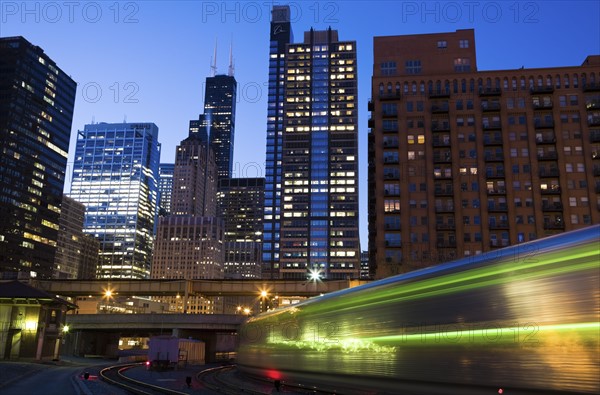 USA, Illinois, Chicago, night cityscape with train. Photo : Henryk Sadura