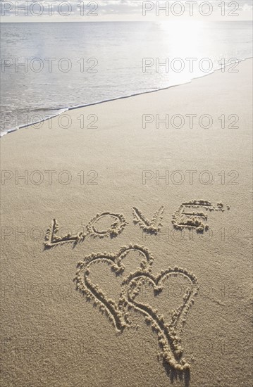 USA, Massachusetts, love sign with heart shapes on sand. Photo : Chris Hackett