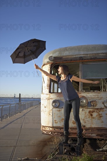 USA, New York City, Brooklyn, woman with umbrella. Photo : Shawn O'Connor