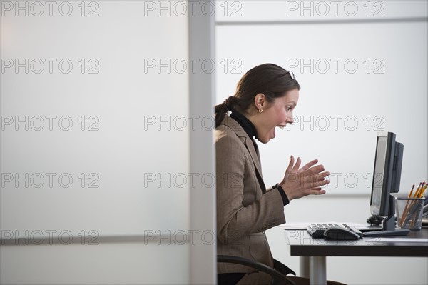 Portrait of young woman in office.