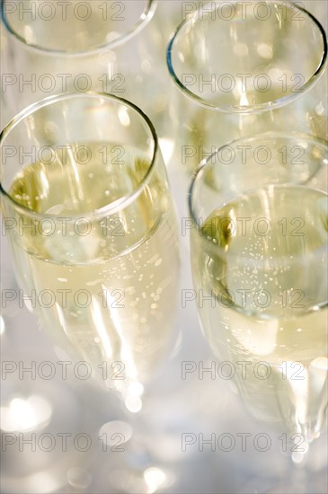 Close up of champagne flutes. Photo : Jamie Grill Photography