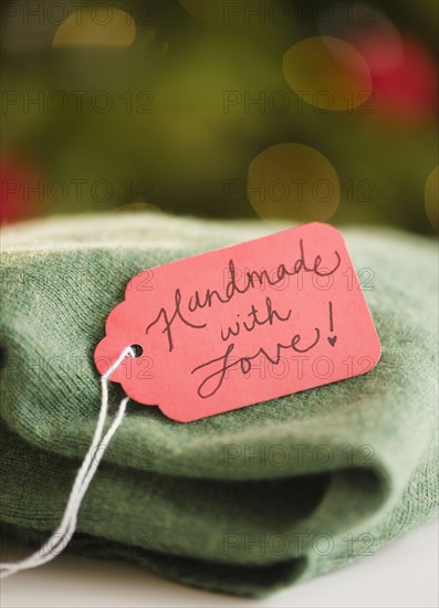 Handmade jumper with tag. Photo : Jamie Grill Photography