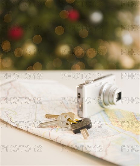 Car keys and camera on map. Photo : Jamie Grill Photography