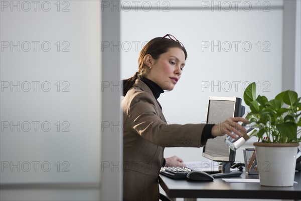 Portrait of young woman in office.