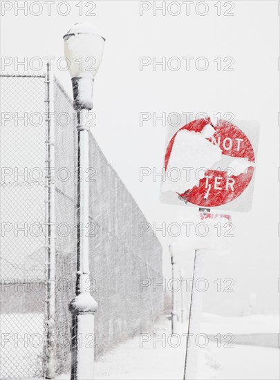 USA, New York State, Rockaway Beach, Do Not Enter Sign covered with snow. Photo : Jamie Grill Photography
