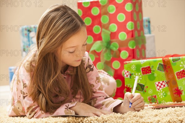 Girl (6-7) preparing Christmas presents. Photo : Mike Kemp