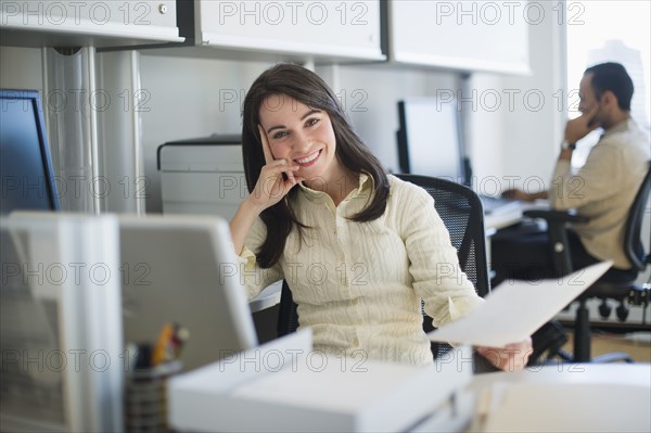 Business woman and man working in office.