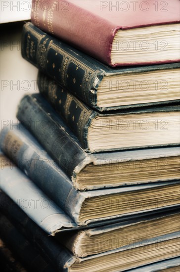 Close up stack of antique books .