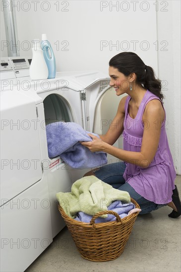 Woman doing laundry.