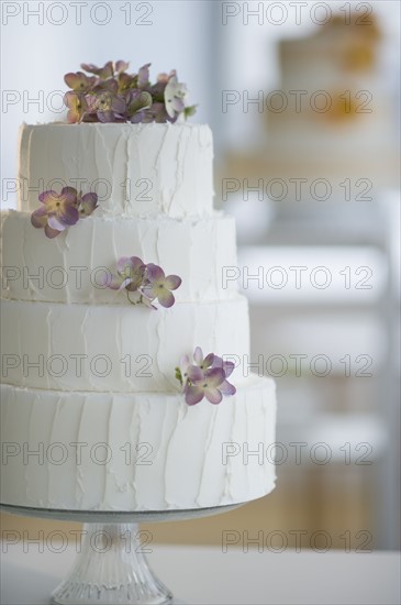 Wedding cake on cake stand.