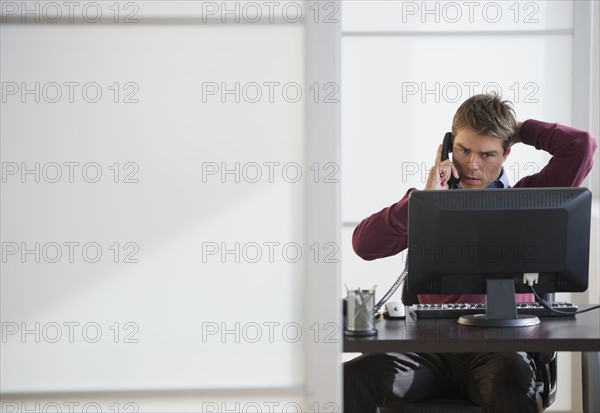 Businessman working in office.