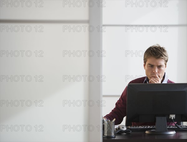 Businessman working in office.