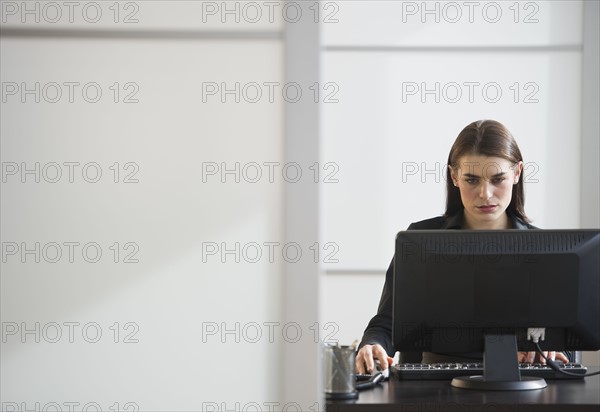 Businesswoman working in office.