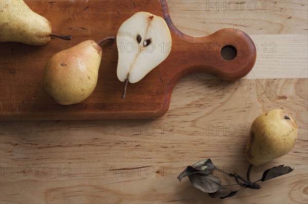Close up of pears on cutting board.
