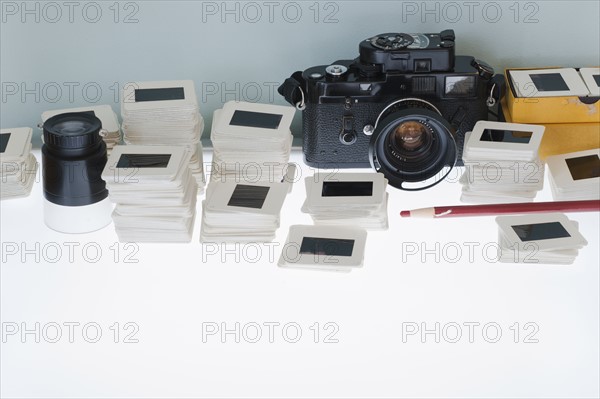 Close up of slides and camera on light box.