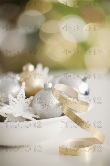 Christmas baubles on plate.