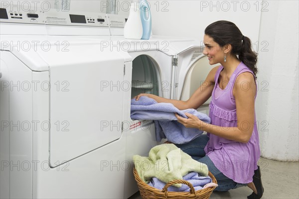 Woman doing laundry.