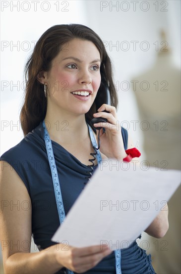 Young fashion designer on the phone.