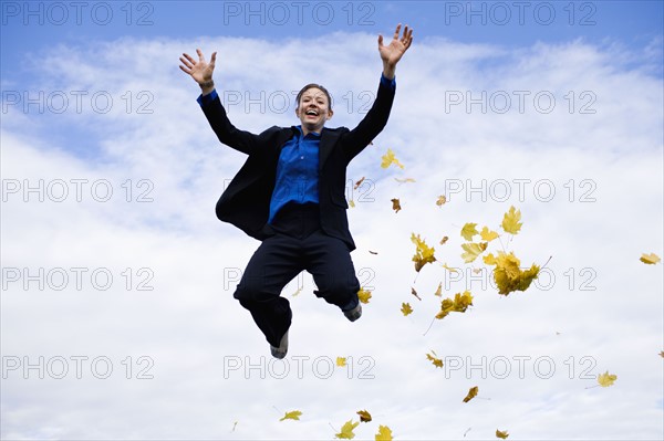 Businessman mid-air. Photo : Noah Clayton