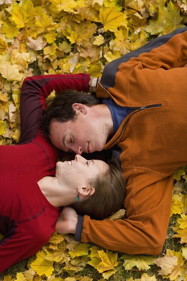 USA, Montana, Kalispell, Happy couple embracing in autumn. Photo : Noah Clayton