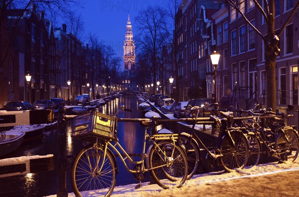 Netherlands, Amsterdam, Bicycles on bridge over canal. Photo : Henryk Sadura