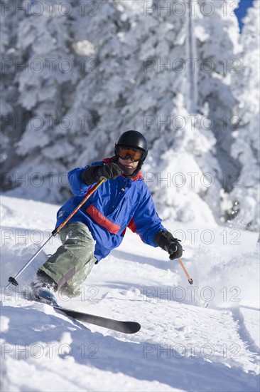 USA, Montana, Whitefish, Male skier on mountain slope. Photo : Noah Clayton