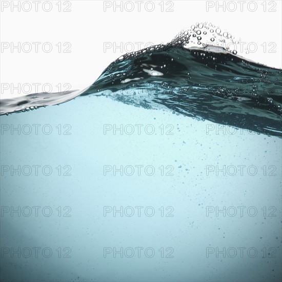 Water with bubbles on white background. Photo : Joe Clark