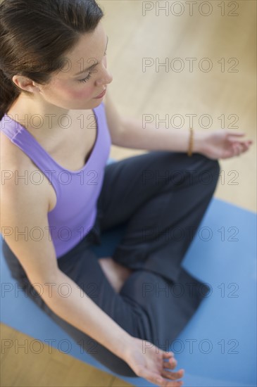 Young woman meditation in lotus position.