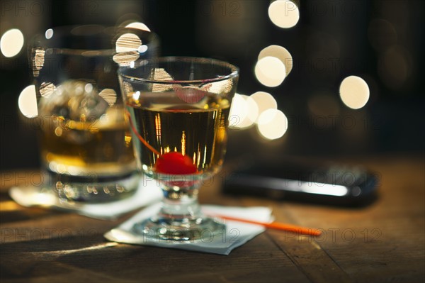 Close-up view of alcoholic drinks on bar counter.