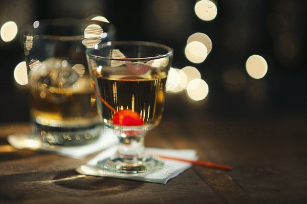 Close-up view of alcoholic drinks on bar counter.