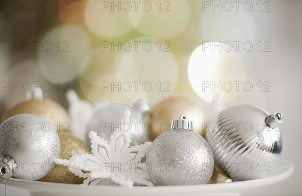 Christmas baubles on plate.