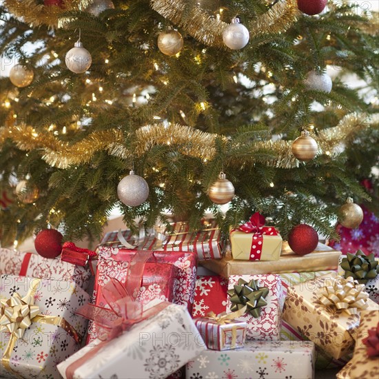 Colorful gifts under christmas tree.