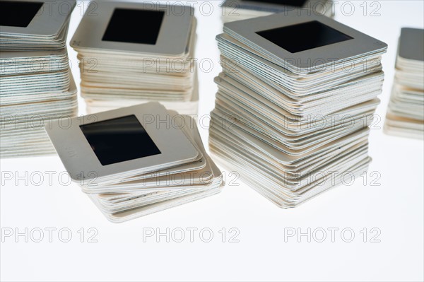 Close up of slides in piles on light box.