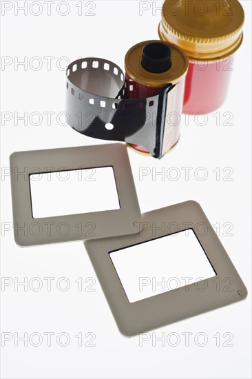 Close up of camera film and slide frames on light box.