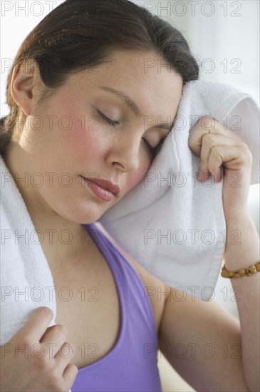 Tired young woman at fitness.