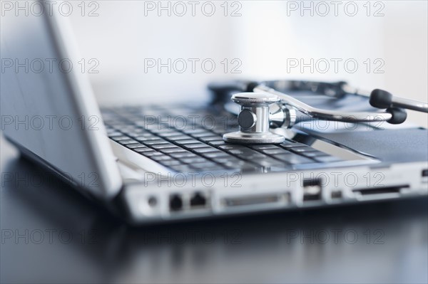 Laptop with stethoscope.