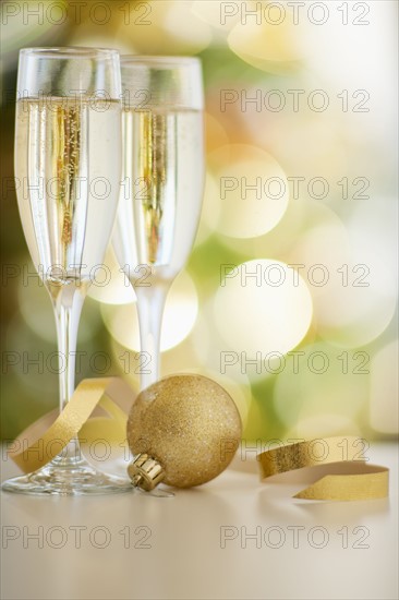 Champagne glasses with christmas bulb.