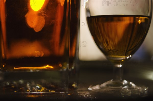 Beer in glasses on bar.