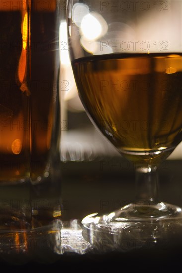 Beer in glasses on bar.