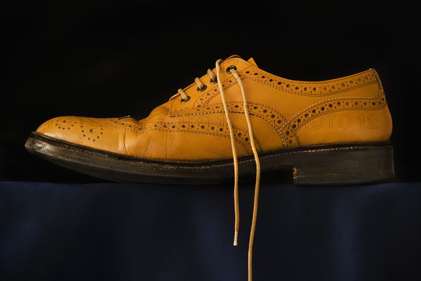 Traditional brogue on black background. Photo : Joe Clark