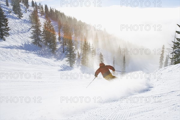 USA, Montana, Whitefish, Male skier on mountain slope. Photo : Noah Clayton