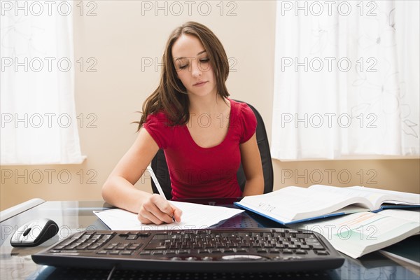 Young woman studying. Photo : Mike Kemp