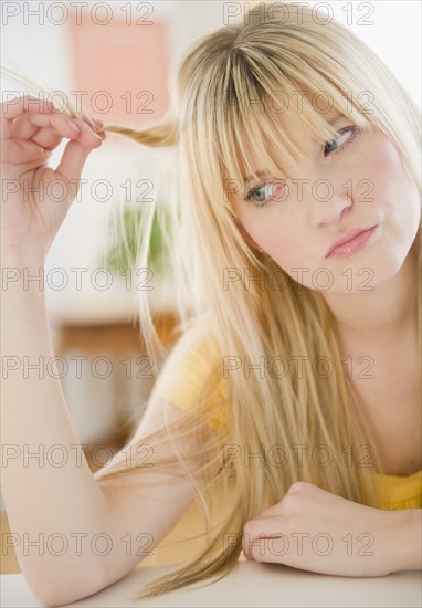 Young woman looking sad. Photo : Jamie Grill Photography