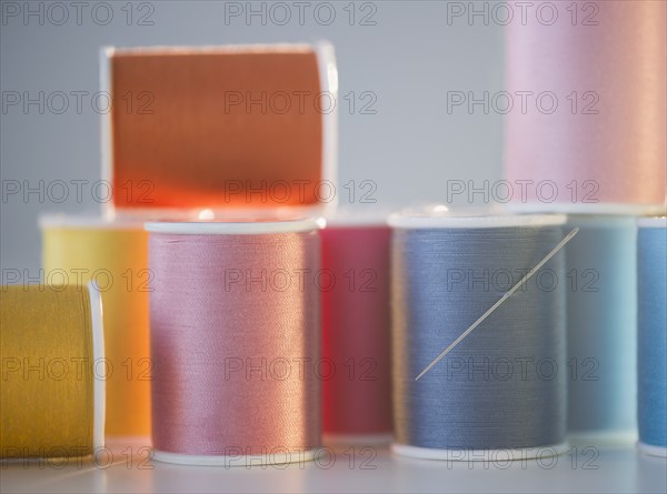 Spools with colorful threads. Photo : Jamie Grill Photography