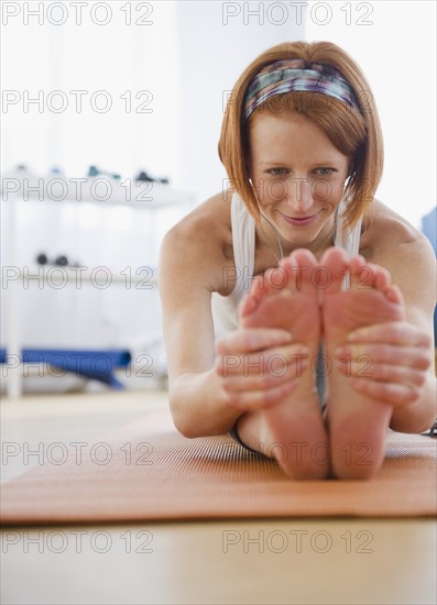 Woman stretching. Photo : Jamie Grill Photography