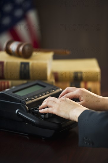 Court stenographer using stenograph machine. Photo : Daniel Grill