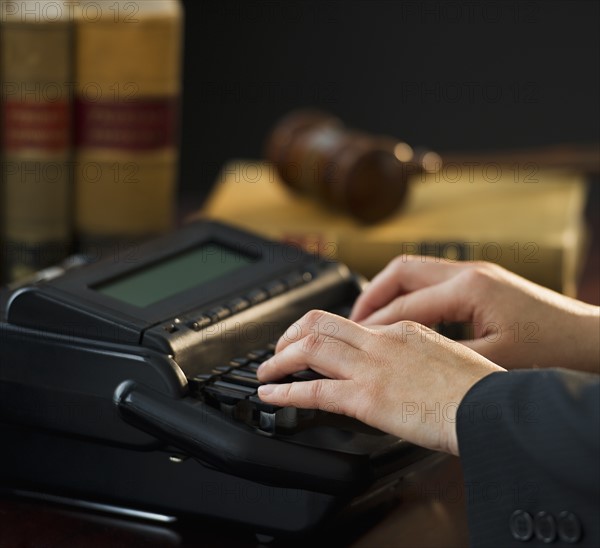 Court stenographer using stenograph machine. Photo: Daniel Grill