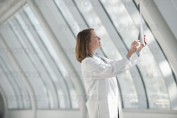 Doctor examining x-ray. Photo : Mark Edward Atkinson