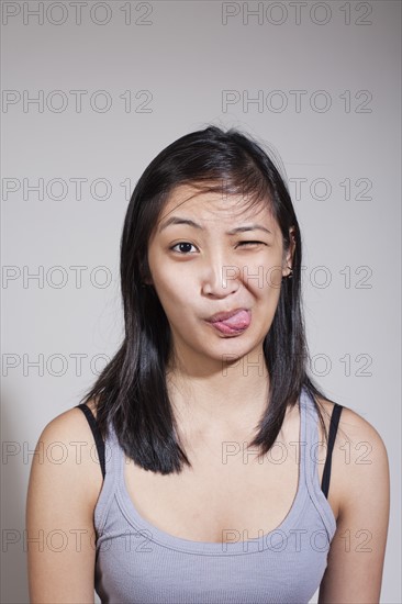 Young woman sticking out tongue. Photo: Winslow Productions