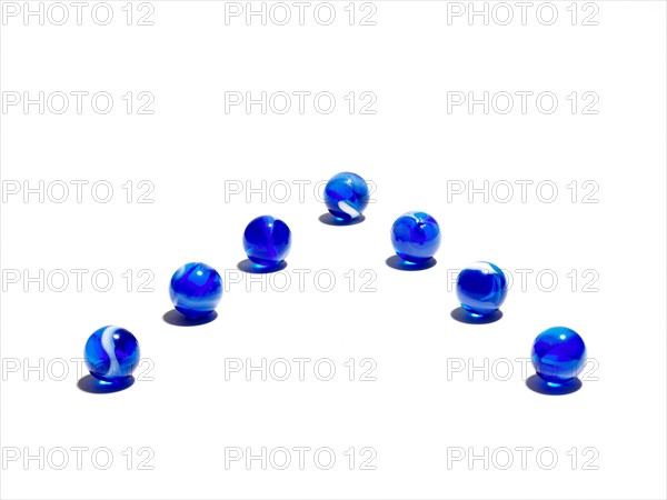 Blue glass balls in a row. Photo : David Arky